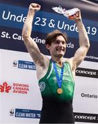 24 August 2024; Paul O'Donovan of Ireland celebrates on the podium with his gold medal after winning the lightweight men's single sculls final at the World Rowing Championships at Royal Canadian Henley Rowing Course in St Catharines, Canada. Photo by Stephen Leithwood/Sportsfile