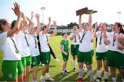 24 August 2024; Leonie O’Donnell of Cabinteely lifts the trophy alongside teammates after their side's victory in the FAI Women’s Amateur Shield Final match between Cabinteely and Dungarvan United at Travers Insurances Park in Arklow, Wicklow. Photo by Seb Daly/Sportsfile