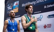 24 August 2024; Paul O'Donovan of Ireland stands for Amhrán na bhFiann with his gold medal after winning the lightweight men's single sculls final at the World Rowing Championships at Royal Canadian Henley Rowing Course in St Catharines, Canada. Photo by Stephen Leithwood/Sportsfile