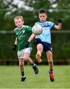 25 August 2024; Bobby Morrisey of Cahersiveen, Kerry, right, in action against Adam Farrell of Kilbride, Roscommon, in Gaelic Football U10 & O7 Boys/Girls/Mixed during the Cairn Community Games National Outdoor Teams Finals at SETU Pitches and Running Track in Carlow. Photo by Piaras Ó Mídheach/Sportsfile