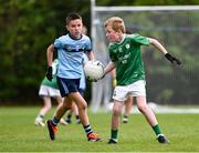 25 August 2024; Adam Farrell of Kilbride, Roscommon, right, in action against Robbie O'Sullivan of Cahersiveen, Kerry, in Gaelic Football U10 & O7 Boys/Girls/Mixed during the Cairn Community Games National Outdoor Teams Finals at SETU Pitches and Running Track in Carlow. Photo by Piaras Ó Mídheach/Sportsfile