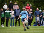 25 August 2024; Shay McCarthy of Cahersiveen, Kerry, in action against Kilbride, Roscommon, in Gaelic Football U10 & O7 Boys/Girls/Mixed during the Cairn Community Games National Outdoor Teams Finals at SETU Pitches and Running Track in Carlow. Photo by Piaras Ó Mídheach/Sportsfile