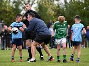 25 August 2024; Declan O'Sullivan, former Kerry footballer and coach of Cahersiveen, Kerry, talking to Robbie O'Sullivan during their match against Kilbride, Roscommon, in Gaelic Football U10 & O7 Boys/Girls/Mixed during the Cairn Community Games National Outdoor Teams Finals at SETU Pitches and Running Track in Carlow. Photo by Piaras Ó Mídheach/Sportsfile