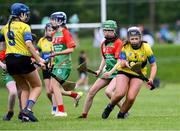 25 August 2024; Amy Travers of Clarecastle-Ballyea, Clare, in action against Inniskeen, Monaghan, in the Camogie U14 & O10 Girls during the Cairn Community Games National Outdoor Teams Finals at SETU Pitches and Running Track in Carlow. Photo by Piaras Ó Mídheach/Sportsfile