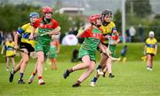 25 August 2024; Lucy Geraghty of Inniskeen, Monaghan, in action against Holly Farmer of Clarecastle-Ballyea, Clare, right, in the Camogie U14 & O10 Girls during the Cairn Community Games National Outdoor Teams Finals at SETU Pitches and Running Track in Carlow. Photo by Piaras Ó Mídheach/Sportsfile