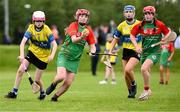 25 August 2024; Lucy Geraghty of Inniskeen, Monaghan, in action against Róisín McDonnell of Clarecastle-Ballyea, Clare, in the Camogie U14 & O10 Girls during the Cairn Community Games National Outdoor Teams Finals at SETU Pitches and Running Track in Carlow. Photo by Piaras Ó Mídheach/Sportsfile