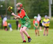 25 August 2024; Shannan Hillard of Inniskeen, Monaghan, in action against Clarecastle-Ballyea, Clare, in the Camogie U14 & O10 Girls during the Cairn Community Games National Outdoor Teams Finals at SETU Pitches and Running Track in Carlow. Photo by Piaras Ó Mídheach/Sportsfile