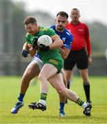 25 August 2024; Brian Darby of Rhode in action against Aaron Leavy of Tullamore during the Offaly Senior Club Football Championship Group 1 Round 3 match between Rhode and Tullamore at Daingean GAA Club in Offaly. Photo by Brendan Moran/Sportsfile