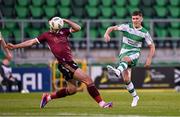 25 August 2024; Darragh Burns of Shamrock Rovers has a shot on goal despite the attention of Greg Cunningham of Galway United during the SSE Airtricity Men's Premier Division match between Shamrock Rovers and Galway United at Tallaght Stadium in Dublin. Photo by Ben McShane/Sportsfile