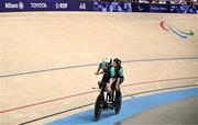 1 September 2024; Katie George Dunlevy, right, and pilot Eve McCrystal of Ireland celebrate qualifying for the final after their women's B 3000m individual pursuit qualifying race on day four of the Paris 2024 Paralympic Games at Vélodrome de Saint-Quentin-en-Yvelines in Paris, France. Photo by Harry Murphy/Sportsfile