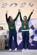 1 September 2024; Katie George Dunlevy, right, and Eve McCrystal of Ireland with their silver medals during the awards ceremony after the women's B 3000m individual pursuit final on day four of the Paris 2024 Paralympic Games at Vélodrome de Saint-Quentin-en-Yvelines in Paris, France. Photo by Ramsey Cardy/Sportsfile