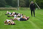 1 September 2024; Crossmaglen Rangers manager Anthony Cunningham looks on as his players warm-up before the Armagh Senior Club Football Championship Group B second round match between High Moss Sarsfields and Crossmaglen Rangers at Fr Dan McGeown Park in Derrytrasna, Armagh. Photo by Piaras Ó Mídheach/Sportsfile