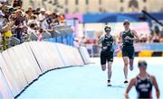 2 September 2024; Chloe MacCombe, left, and guide Catherine A Sands of Ireland on their way to finishing in sixth place in the women's PTVI race on day five of the Paris 2024 Paralympic Games at Pont Alexandre III in Paris, France. Photo by Ramsey Cardy/Sportsfile