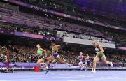 3 September 2024; Orla Comerford of Ireland, right, crosses the line to win a bronze medal, alongside gold medallist Lamiya Valiyeva of Azerbaijan, left, and silver medallist Rayane Soares da Silva of Brazil, in the women's T13 100m final on day six of the Paris 2024 Paralympic Games at Stade de France in Paris, France.  Photo by Harry Murphy/Sportsfile