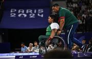 7 September 2024; Britney Arendse of Ireland with coach and father Denver Arendse after her third lift in the women's 79kg final on day ten of the Paris 2024 Paralympic Games at Porte de la Chapelle Arena in Paris, France. Photo by Harry Murphy/Sportsfile