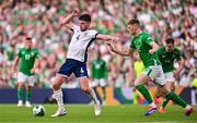 7 September 2024; Declan Rice of England in action against Jake O'Brien of Republic of Ireland during the UEFA Nations League B Group 2 match between Republic of Ireland and England at Aviva Stadium in Dublin. Photo by Ben McShane/Sportsfile