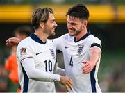 7 September 2024; Jack Grealish, left, and Declan Rice of England celebrate at the final whistle of the UEFA Nations League B Group 2 match between Republic of Ireland and England at the Aviva Stadium in Dublin. Photo by Seb Daly/Sportsfile