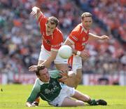 7 August 2004; James Sherry, Fermanagh, in action against Paddy McKeever, left, and Kieran McGeeney, Armagh. Bank of Ireland All-Ireland Senior Football Championship Quarter Final, Armagh v Fermanagh, Croke Park, Dublin. Picture credit; Ray McManus / SPORTSFILE