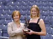 17 August 2004; Jocelyn Emerson, Lucozade Sport, left, presents the Lucozade Sport Irish Independent Ladies Gaelic Footballer of the Month for July to Dublin's Fiona Corcoran. Croke Park, Dublin. Picture credit; Brian Lawless / SPORTSFILE