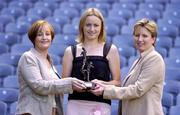 17 August 2004; Jocelyn Emerson, Lucozade Sport, left, and Geraldine Giles, President of the Ladies Football Association, right, present the Lucozade Sport Irish Independent Ladies Gaelic Footballer of the Month for July to Dublin's Fiona Corcoran. Croke Park, Dublin. Picture credit; Brian Lawless / SPORTSFILE