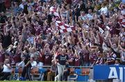 14 August 2004; Westmeath fans cheer on their side as Paidi O Se, Westmeath manager, makes his way along the sideline. Bank of Ireland Senior Football Championship Quarter-Final, Westmeath v Derry, Croke Park, Dublin. Picture credit; Ray McManus / SPORTSFILE