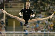 19 August 2004; Svetlana Khorkina of Russia goes through her routine on the Uneven bars on her way to winning Silver in the Women's Individual All Round Final in Artistic Gymnastics. Olympic Indoor Hall. Games of the XXVIII Olympiad, Athens Summer Olympics Games 2004, Athens, Greece. Picture credit; Brendan Moran / SPORTSFILE