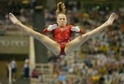 19 August 2004; Carly Patterson of the USA goes through her routine on the Uneven bars on her way to winning Gold in the Women's Individual All Round Final in Artistic Gymnastics. Olympic Indoor Hall. Games of the XXVIII Olympiad, Athens Summer Olympics Games 2004, Athens, Greece. Picture credit; Brendan Moran / SPORTSFILE
