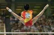 19 August 2004; Nan Zhang of China goes through her routine on the Uneven bars on her way to winning Bronze in the Women's Individual All Round Final in Artistic Gymnastics. Olympic Indoor Hall. Games of the XXVIII Olympiad, Athens Summer Olympics Games 2004, Athens, Greece. Picture credit; Brendan Moran / SPORTSFILE