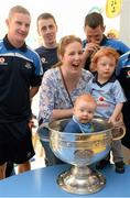 23 September 2013; Roisin Clarke and her sons Victor, 18 months, and Nicholas, 6 months, from Rathgar, with Dublin players, from left, Ciaran Kilkenny, Cormac Costello and Denis Bastick with the Sam Maguire cup on a visit by the All-Ireland Senior Football Champions to Our Lady's Hospital for Sick Children, Crumlin. Picture credit: Brian Lawless / SPORTSFILE