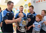 23 September 2013; Roisin Clarke and her sons Victor, 18 months, and Nicholas, 6 months, from Rathgar, with Dublin players, from left, Denis Bastick, Ciaran Kilkenny, and Jack McCaffrey with the Sam Maguire cup on a visit by the All-Ireland Senior Football Champions to Our Lady's Hospital for Sick Children, Crumlin. Picture credit: Brian Lawless / SPORTSFILE