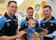 23 September 2013; Nicholas Clarke, age 6 months, from Rathgar, with Dublin players, from left, Denis Bastick, Ciaran Kilkenny and Jack McCaffrey with the Sam Maguire cup on a visit by the All-Ireland Senior Football Champions to Our Lady's Hospital for Sick Children, Crumlin. Picture credit: Brian Lawless / SPORTSFILE