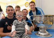 23 September 2013; Jim Shields, age 2, from Portlaoise, with Dublin players, from left, Cormac Costello, Ciaran Kilkenny, Jack McCaffrey and Kevin Nolan with the Sam Maguire cup on a visit by the All-Ireland Senior Football Champions to Our Lady's Hospital for Sick Children, Crumlin. Picture credit: Brian Lawless / SPORTSFILE
