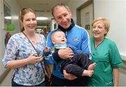23 September 2013; Dublin manager Jim Gavin with Roisin Clarke and her son Nicholas, 6 months, from Rathgar, and Bernadette McNicholas, right, with the Sam Maguire cup on a visit by the All-Ireland Senior Football Champions to Our Lady's Hospital for Sick Children, Crumlin. Picture credit: Brian Lawless / SPORTSFILE