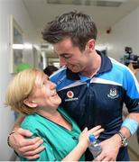 23 September 2013; Dublin's Michael Darragh MacAuley with Bernadette McNicholas on a visit by the All-Ireland Senior Football Champions to Our Lady's Hospital for Sick Children, Crumlin. Picture credit: Brian Lawless / SPORTSFILE