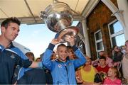 23 September 2013; Dublin's Jonny Cooper, right, and Michael Darragh MacAuley arrive at the hospital with the Sam Maguire cup on a visit by the All-Ireland Senior Football Champions to Our Lady's Hospital for Sick Children, Crumlin. Picture credit: Brian Lawless / SPORTSFILE