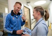 23 September 2013; Dublin's Jonny Cooper with Naomi Bartley, Clinical Placement Co-ordinator, on a visit by the All-Ireland Senior Football Champions to Our Lady's Hospital for Sick Children, Crumlin. Picture credit: Brian Lawless / SPORTSFILE