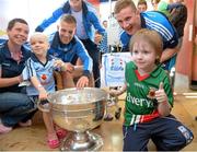 23 September 2013; Dublin players Jonny Cooper and Ciaran Kilkenny, right, with Mayo supporter Rory Carroll and Dublin supporters Brea Mullarkey, aged 3, from Garristown, and her mother Elaine with the Sam Maguire cup on a visit by the All-Ireland Senior Football Champions to Our Lady's Hospital for Sick Children, Crumlin. Picture credit: Brian Lawless / SPORTSFILE