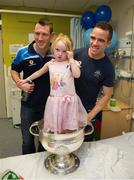 23 September 2013; Dublin's Denis Bastick, left, and Ger Brennan with 3 year old Sorcha Kelly, from Baldoyle, Co. Dublin, and the Sam Maguire cup on a visit by the All-Ireland Senior Football Champions to Temple Street Children's University Hospital, Temple Street, Dublin.  Picture credit: Ray McManus / SPORTSFILE