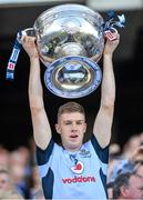 22 September 2013; Dublin's Shane Carthy lifts the Sam Maguire cup following their victory. GAA Football All-Ireland Senior Championship Final, Dublin v Mayo, Croke Park, Dublin. Picture credit: Stephen McCarthy / SPORTSFILE