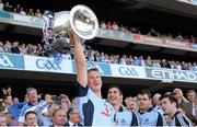 22 September 2013; Ciaran Kilkenny, Dublin, lifts the Sam Maguire cup. GAA Football All-Ireland Senior Championship Final, Dublin v Mayo, Croke Park, Dublin. Picture credit: Ray McManus / SPORTSFILE