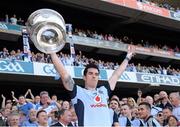 22 September 2013; Michael Darragh MacAuley, Dublin, lifts the Sam Maguire cup. GAA Football All-Ireland Senior Championship Final, Dublin v Mayo, Croke Park, Dublin. Picture credit: Ray McManus / SPORTSFILE