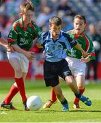 22 September 2013; Paraic Hughes, from Ballythomas N.S. Gorey, Wexford, representing Dublin, in action against Diarmaid De Rút, from Gaeilscoil Eoghan Uí Thuairisc, Carlow, representing Mayo. INTO/RESPECT Exhibition GoGames during the GAA Football All-Ireland Senior Championship Final between Dublin and Mayo, Croke Park, Dublin. Picture credit: David Maher / SPORTSFILE