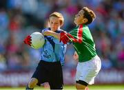 22 September 2013; Diarmaid Gallagher, from St. Teresa's P.S. Omagh, Tyrone, representing Dublin, in action against David Maloney, from St. Cronan's Boys N.S. Bray, Wicklow, representing Mayo. INTO/RESPECT Exhibition GoGames during the GAA Football All-Ireland Senior Championship Final between Dublin and Mayo, Croke Park, Dublin. Photo by Sportsfile