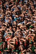 22 September 2013; Mayo and Dublin supporters shield their eys from the sun. GAA Football All-Ireland Senior Championship Final, Dublin v Mayo, Croke Park, Dublin. Picture credit: Ray McManus / SPORTSFILE