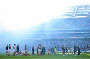 22 September 2013; The Mayo team look on during the presentation of the Sam Maguire cup amid heavy smoke from after match fireworks. GAA Football All-Ireland Senior Championship Final, Dublin v Mayo, Croke Park, Dublin.  Picture credit: Brendan Moran / SPORTSFILE