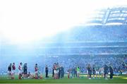22 September 2013; The Mayo team look on during the presentation of the Sam Maguire cup amid heavy smoke from after match fireworks. GAA Football All-Ireland Senior Championship Final, Dublin v Mayo, Croke Park, Dublin.  Picture credit: Brendan Moran / SPORTSFILE