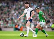 7 September 2024; Declan Rice of England in action against Sammie Szmodics of Republic of Ireland during the UEFA Nations League B Group 2 match between Republic of Ireland and England at the Aviva Stadium in Dublin. Photo by Seb Daly/Sportsfile