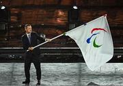 8 September 2024; President of the International Paralympic Committee Andrew Parsons with the Paralympics flag during the closing ceremony of the Paris 2024 Paralympic Games in Paris, France. Photo by Harry Murphy/Sportsfile