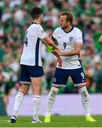 7 September 2024; Harry Kane, right, removes the England captain's armband from the arm of team-mate Declan Rice during the UEFA Nations League B Group 2 match between Republic of Ireland and England at Aviva Stadium in Dublin. Photo by Stephen McCarthy/Sportsfile