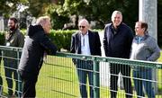9 September 2024; Head coach Heimir Hallgrimsson with, from left, Philip Quinn of The Irish Daily Mail, FAI international and high performance committee Packie Bonner and John Fallon of The Irish Examiner during a Republic of Ireland training session at the FAI National Training Centre in Abbotstown, Dublin. Photo by Stephen McCarthy/Sportsfile